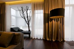 Floor-length curtains in the living room interior