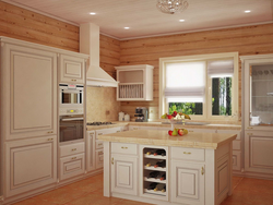 White kitchen in the interior of a wooden house