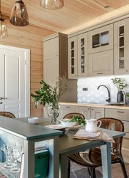 White kitchen in the interior of a wooden house