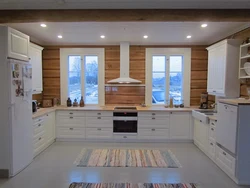 White Kitchen In The Interior Of A Wooden House