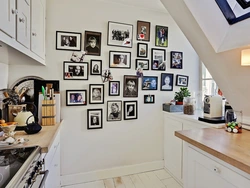 Wall with frames in the kitchen interior