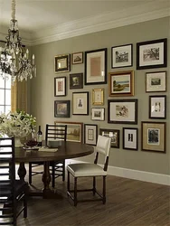 Wall with frames in the kitchen interior
