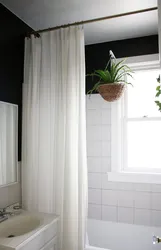 White curtain in the bathroom in the interior