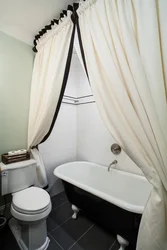 White curtain in the bathroom in the interior