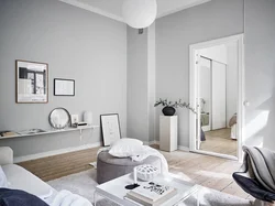 Интерьер гостиной серый пол белые стены