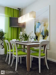 Green chairs in the interior of a gray kitchen