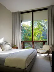 Bedroom interior with floor-to-ceiling windows