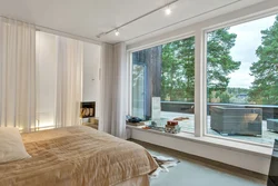 Bedroom interior with floor-to-ceiling windows