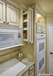 Refrigerator and stove in the kitchen interior