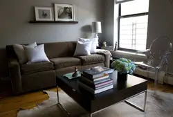 Sofa in living room interior with gray walls