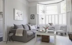 Sofa in living room interior with gray walls