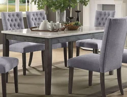 Gray table and chairs in the kitchen interior