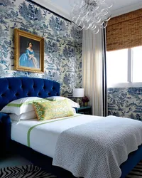 Curtains in the interior of a bedroom with a blue bed