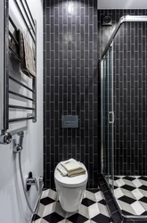 Black Shower Cabin In The Interior Of A White Bath