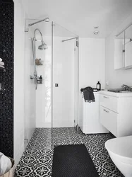 Black Shower Cabin In The Interior Of A White Bath