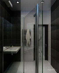 Black Shower Cabin In The Interior Of A White Bath