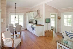 White kitchen interior in a timber house
