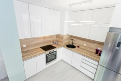 Kitchen without handles white glossy in the interior