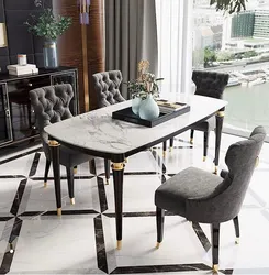 White table with black legs in the kitchen interior