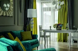 Curtains in a gray living room interior with a green sofa