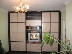 Wardrobe with space for a TV in the living room photo