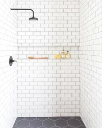 White tiles in the bathroom with black grout photo in the interior