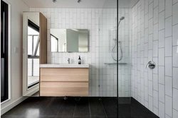 White tiles in the bathroom with black grout photo in the interior