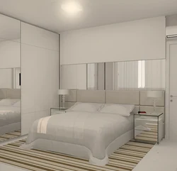 Bedroom design with built-in wardrobe and bed