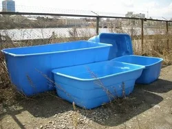 Plastic bathtub for a summer residence photo