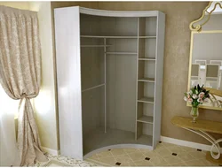 Corner Wardrobe In The Bedroom With Mirrors And Drawers Photo