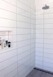 White tiles in the bathroom with white grout photo