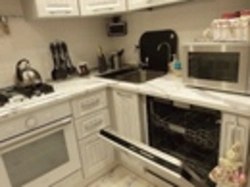 Kitchen In Khrushchev With Dishwasher And Refrigerator Photo