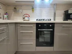 Kitchen in Khrushchev with dishwasher and refrigerator photo