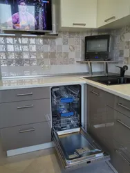 Kitchen in Khrushchev with dishwasher and refrigerator photo