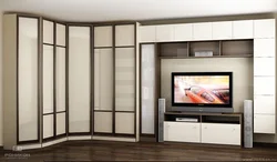 Wardrobe wall with TV in the bedroom photo