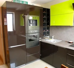 Kitchen design with built-in appliances and refrigerator photo