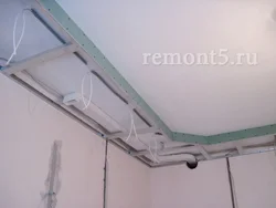 Hood under a suspended ceiling in the kitchen photo