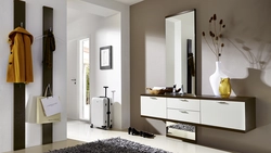 Hallway design with cabinet and mirror