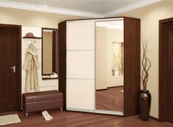 Corner wardrobe in the hallway with a mirror photo