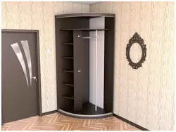 Corner wardrobe in the hallway with a mirror photo