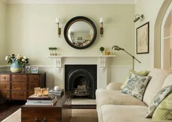 Mirror above the fireplace in the living room interior