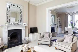 Mirror above the fireplace in the living room interior