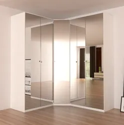 Photo Of A Corner Wardrobe In The Bedroom With A Mirror