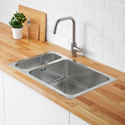 Sink On A Wooden Countertop In The Kitchen Photo