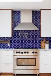 Apron for a blue kitchen made of tiles photo