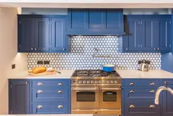 Apron for a blue kitchen made of tiles photo