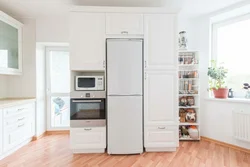 Photo of a kitchen with a pencil case and a refrigerator photo