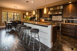 Brown tiles on the floor in the kitchen interior