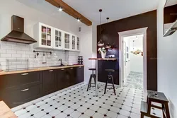 Brown tiles on the floor in the kitchen interior
