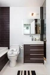 Bathroom design with dark door